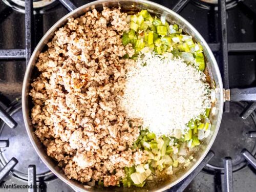 Step 5 how to make sausage rice cream of mushroom casserole, Add the rice and cooked sausage to the skillet.