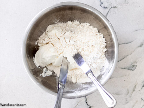 Step 1 how to make 7-up biscuits, Using a butter knife, cut the sour cream into the Bisquick.