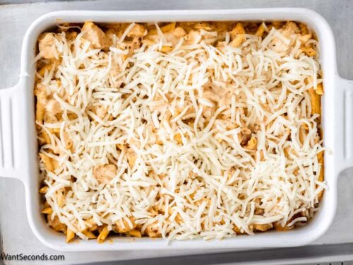 Step 8 how to make buffalo chicken casserole with cream cheese, Remove from the oven and remove the foil. Sprinkle cheese on top and continue to bake, uncovered.