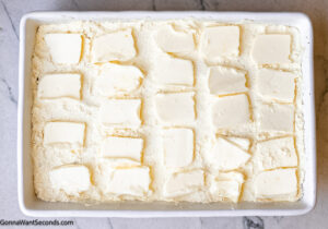 Step 5 how to make caramel apple dump cake with pecans, Arrange butter slices evenly over the cake mix.