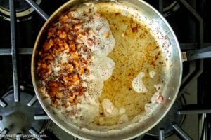 Step 1 how to make smothered potatoes, Cook the bacon and set aside.