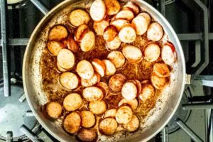 Step 2 how to make Southern smothered potatoes, Cook the sausage.