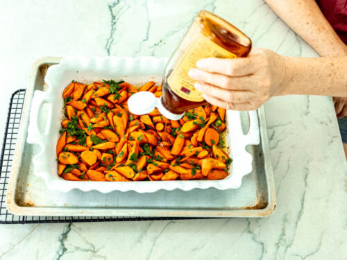 Step 6 how to make candied roasted carrots, Drizzle with honey.