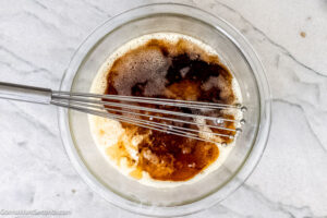 Step 7 how to make chess pie, Add the cooled butter, milk, vinegar, and vanilla to the sugar-flour mixture.