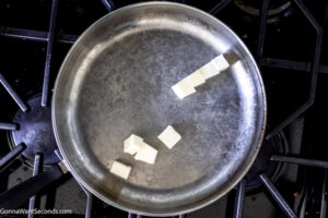 Step 1 how to make creamed peas, Melt the butter in a skillet.
