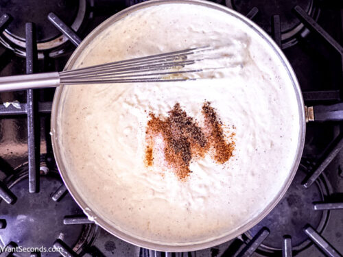 Step 7 how to make creamed spinach, Stir in nutmeg, allspice, cajun seasoning, salt and pepper.