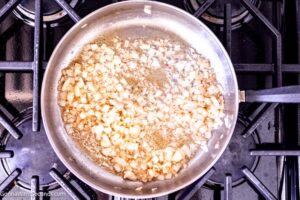 Step 3 how to make fresh creamed spinach, Saute the onions and shallots.