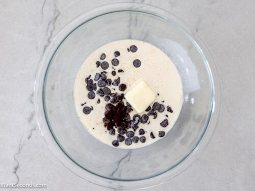 Step 1 how to make fudge pie, In a bowl, add evaporated milk, chocolate morsels, espresso powder, and butter. Melt in the microwave.