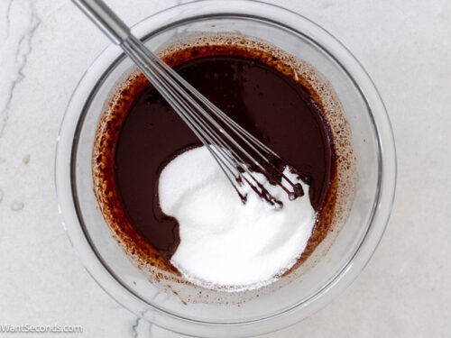 Step 2 how to make fudge pie with pecans, Add sugar and flour to chocolate mixture and whisk.