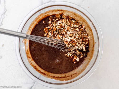 Step 4 how to make old fashioned fudge pie, Add vanilla and salt then whisk. Add pecans and stir.