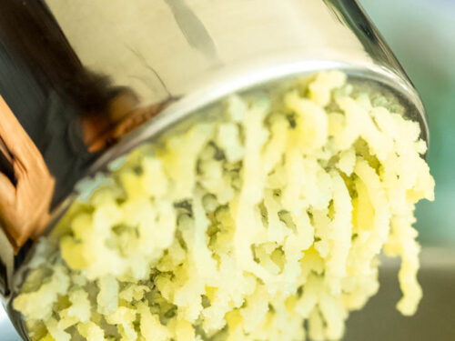 Step 3 how to make mashed potatoes, Put the potatoes through the ricer.