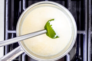 Step 2 how to make creamy mashed potatoes, Heat the heavy cream and butter in a saucepan.