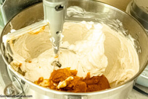 Step 7 how to make pumpkin cheesecake, Add pumpkin and beat until smooth.