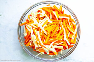 Step 1 how to make roasted carrots and parsnips, Cut the carrots and parsnips.