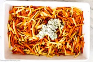 Step 5 how to make roasted carrots and parsnips, Add the herb butter.