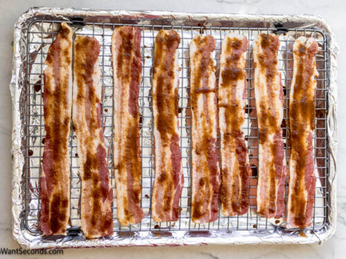 Step 4 how to make million dollar bacon, Arrange bacon slices on the wire rack. Bake and remove from the oven.