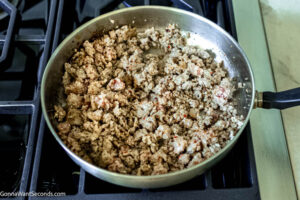 Step 1 how to make pizza casserole, Cook and crumble the sausage until there's no longer any pink. Set aside.