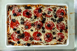 Step 4 how to make pizza bake casserole, Pour mixture into prepared baking dish. Cover with foil and bake.