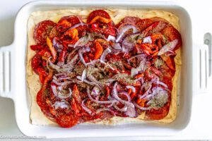Step 9 how to make antipasto squares, Sprinkle Italian seasoning. Pour 3/4 of the egg mixture over the layered meats and cheeses.