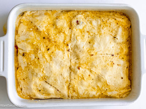 Step 10 how to make antipasto squares, Lay the other unrolled crescent roll dough over the meats and cheeses. Evenly brush the remaining egg mixture over the top. Bake covered with foil.