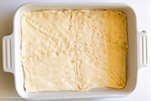Step 1 how to make antipasto squares, Unroll the dough. Lay it in the bottom of the prepared pan.