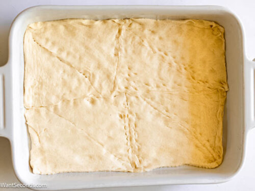 Step 1 how to make antipasto squares, Unroll the dough. Lay it in the bottom of the prepared pan.