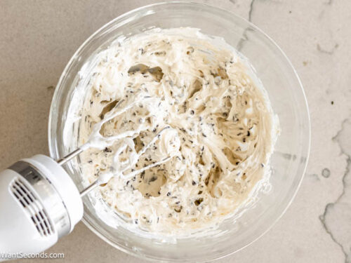 Step 2 how to make Booty dip dessert, Using a hand-held electric mixer, beat together until evenly combined. Add Cool Whip and mini chocolate chips and gently fold with a large rubber spatula.