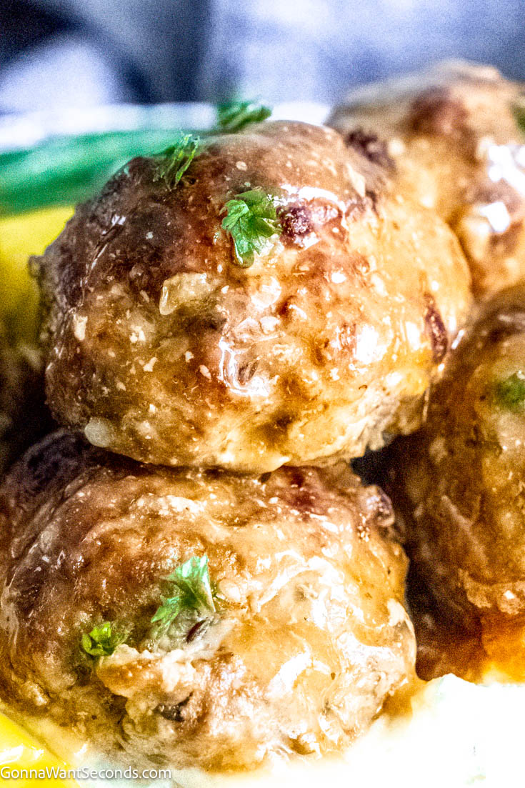 Our Crockpot Mississippi meatballs follow the delicious Mississippi recipes tradition. Moist tender meatballs in a brothy gravy flavored with pepperoncini, ranch dressing and au jus gravy. #crockpotmeatballs #mississippimeatballs Mississippi meatballs close up