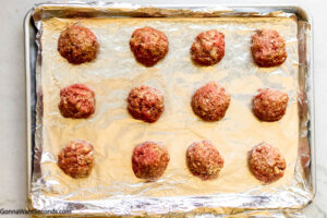 Step 3 how to make Mississippi meatballs with beef broth, Form the mixture into meatballs. Arrange it on a baking sheet and bake.