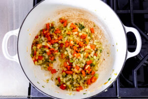 Step 2 how to make pinto bean and ham soup, In a pot, saute the veggies.