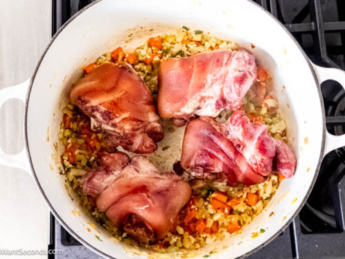 Step 4 how to make pinto bean soup with ham hocks, Add the ham hocks and water and boil.