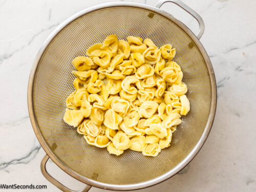 Step 1 how to make tortellini casserole, Cook the tortellini according to the package instructions.