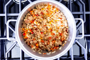 Step 2 how to make tortellini casserole with sausage, Saute the aromatics and add the sausage.