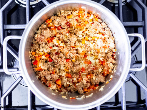 Step 2 how to make tortellini casserole with sausage, Saute the aromatics and add the sausage.