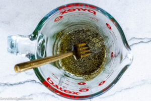 Step 3 how to make sheet pan Mediterranean vegetables, Mix and whisk the olive oil and Italian seasoning.