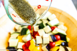 Step 4 how to make roasted Mediterranean vegetables with balsamic, Toss the vegetables with the olive oil mixture.