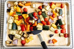 Step 6 how to make Mediterranean roasted vegetables, Flip the veggies over. Roast again.