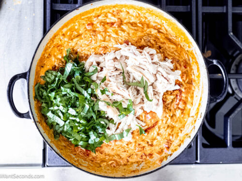 Step 7 how to make Marry me chicken orzo, Stir in the cooked chicken, and basil.