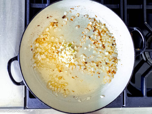 Step 2 how to make one pan marry me chicken orzo, Stir in the garlic and cook until fragrant.