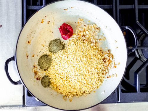 Step 3 how to make marry me creamy chicken orzo, Stir in the orzo, tomato paste, Italian seasoning, salt and pepper, and a pinch of sugar.