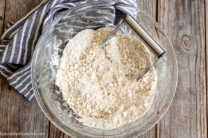 Step 6 how to make cherry cobbler, Use a pastry blender to cut the butter until it looks like a coarse meal.