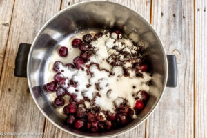 Step 1 how to make cherry cobbler, Make the filling: in a saucepan, add cherries, sugar, cornstarch, and lemon juice. Stir.