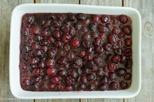 Step 4 how to make cherry cobbler, Pour the cherry mixture into the prepared baking dish.