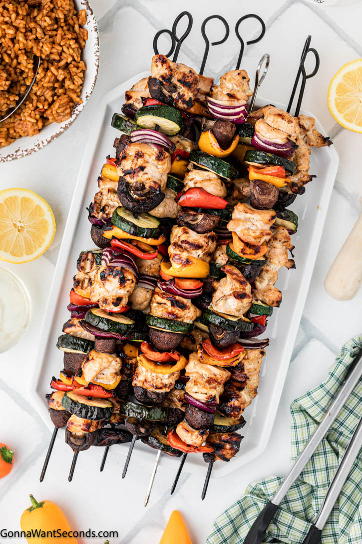 My go-to recipe in the summer is grilled chicken kebabs. Its marinade, with the powerful punch of Worcestershire sauce, adds great flavor to the chicken. #chickenkebabs #kebabs grilled chicken kebabs on a serving platter