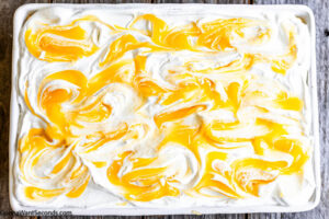 Step 12 how to make no-bake lemon icebox cake, Decoratively swirl the lemon curd. Cover with plastic wrap and refrigerate overnight and serve.