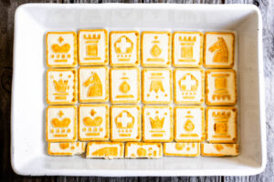 Step 1 how to make lemon icebox cake, Line the bottom of the pan with a single layer of Chessman cookies.
