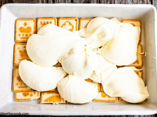 Step 5 how to make no bake lemon icebox cake, Scoop half the pudding mix over the layer of Chessman cookies.