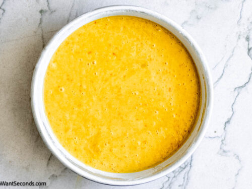 Step 6 how to make orange layer cake, Pour batter evenly into prepared pans. Bake.
