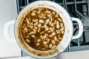 Step 6 how to make rigatoni d maggiano's, Pour chardonnay and marsala into the pan and cook.