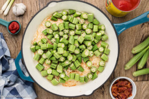 Step 2 how to make Stewed Okra and Tomatoes, Add the chopped okra and vinegar and cook. Set aside.